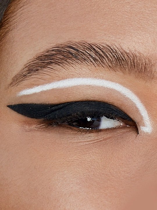 close-up of model wearing black and white eyeliner look