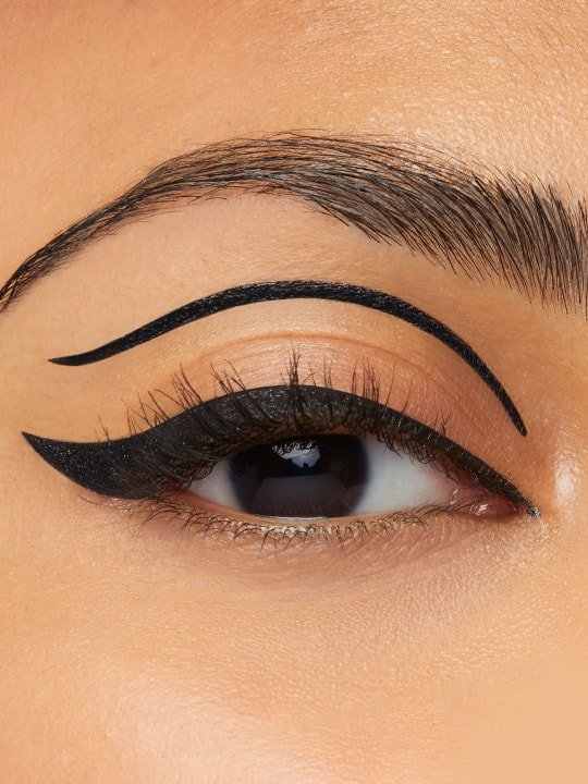 close-up of model wearing a bold black creative eyeliner look