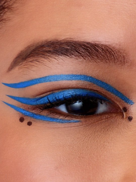 close-up of model wearing a blue graphic eyeliner look