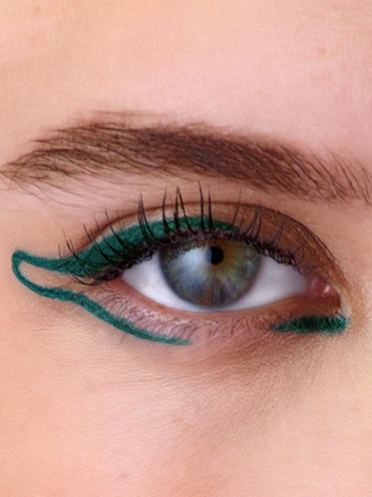 close-up of model wearing green eyeliner look