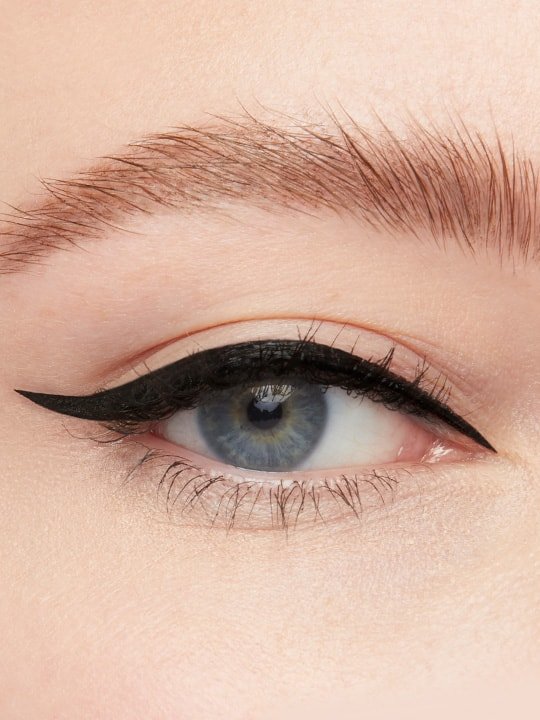 close-up of model wearing a black cat eye eyeliner