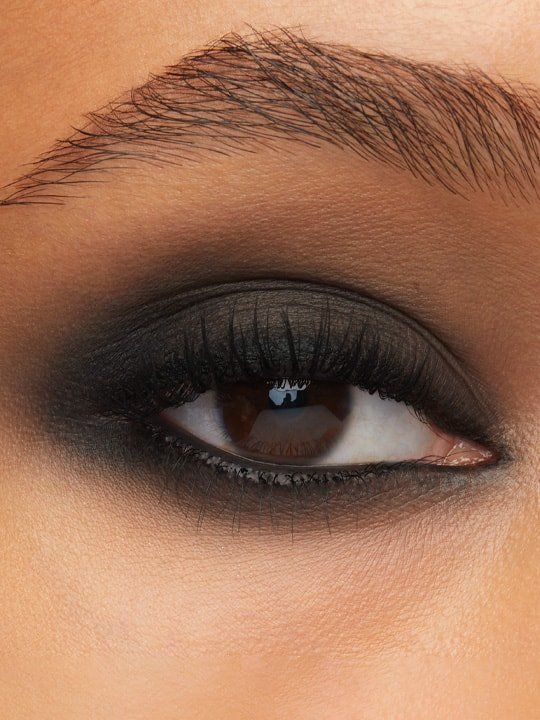 close-up of model wearing black smokey eyeliner makeup