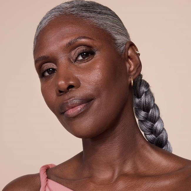 woman showcasing her foundation for mature skin