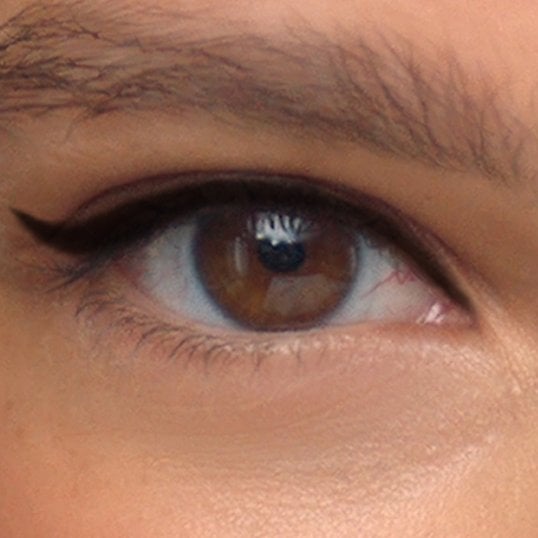 Bronze and copper eyeliner look bringing out the golden flecks in hazel eyes.